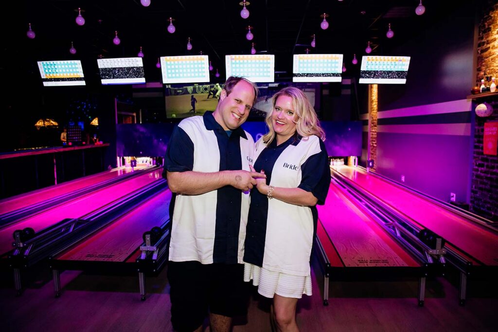 Bride and groom in matching bowling shirts at Wonderbowl after party in Omaha Nebraska